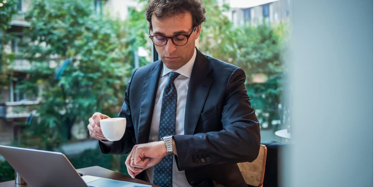 businessman holding an espresso