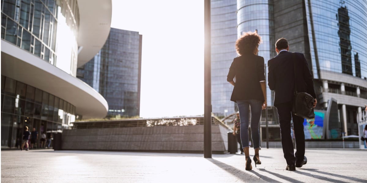 business people walking outside