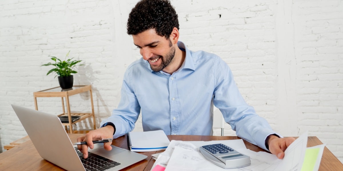 happy man working on his laptop