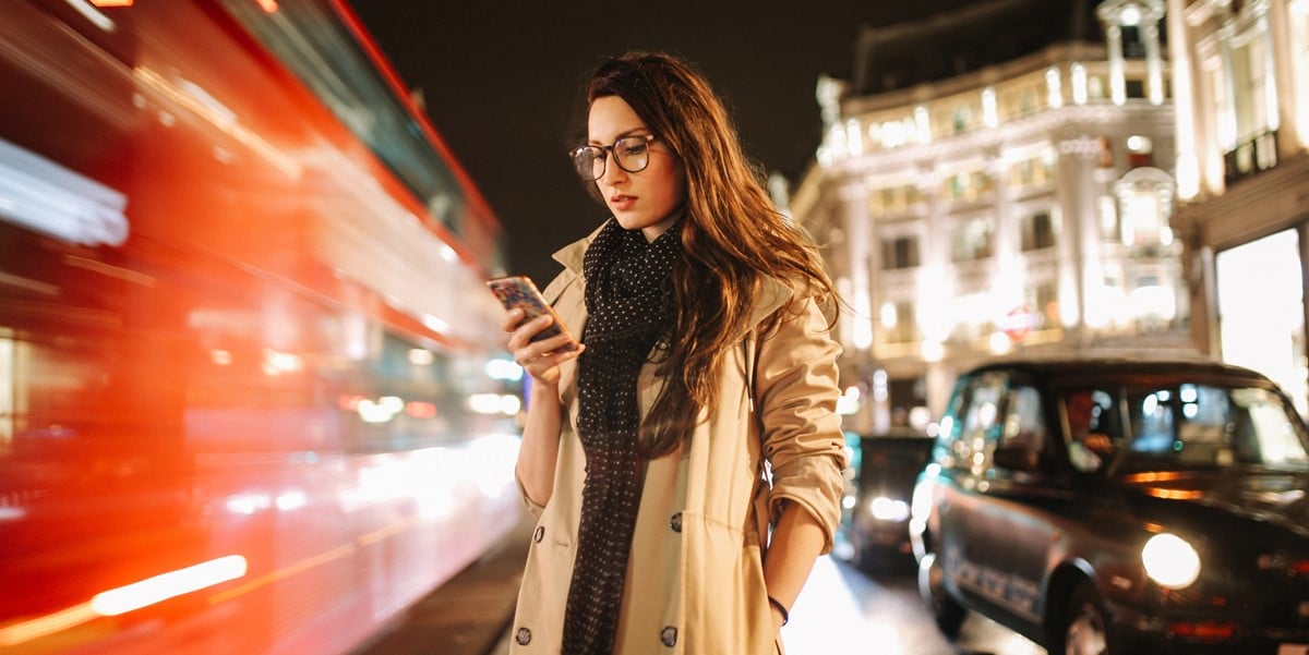 traveler in city looking at cellphone