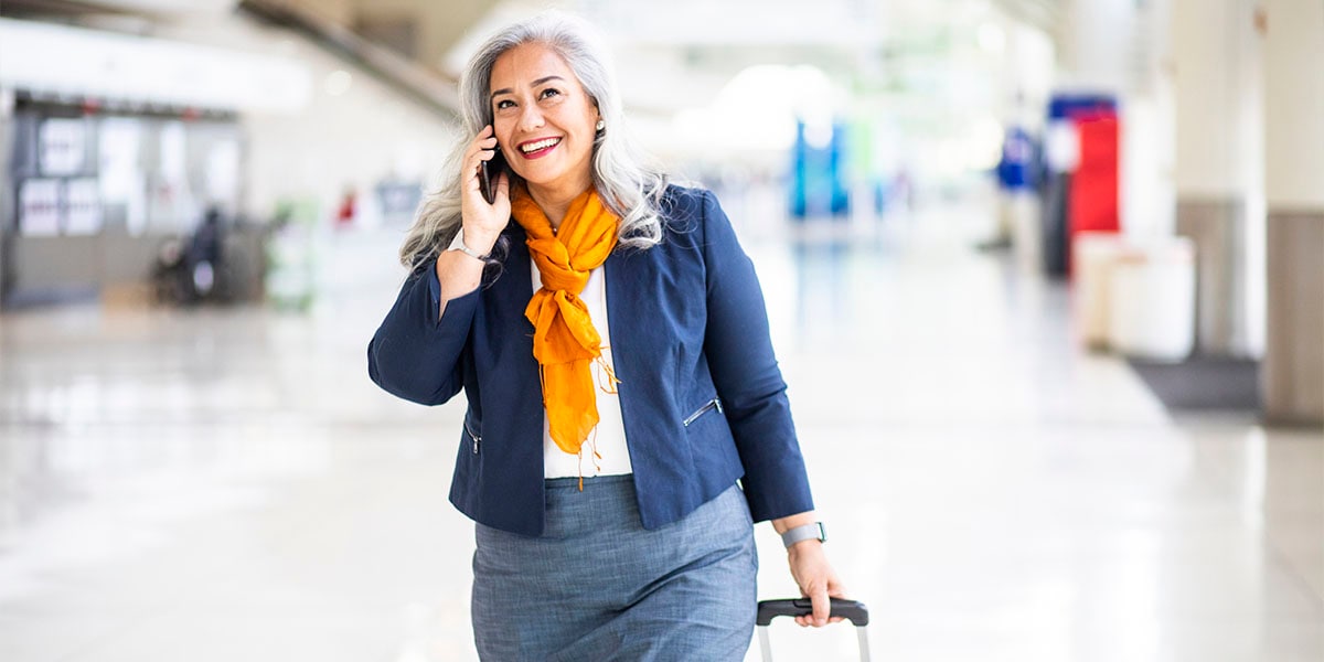 woman talking on the phone while traveling