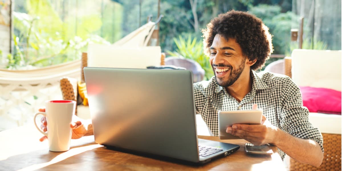 young man using laptop outside