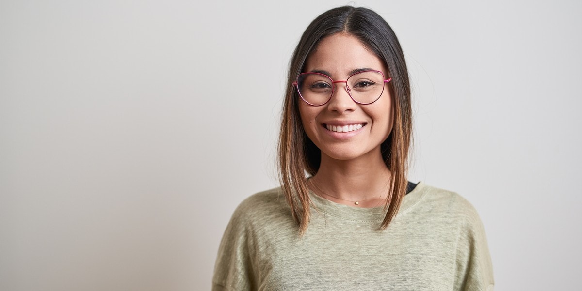 woman with glasses smiling