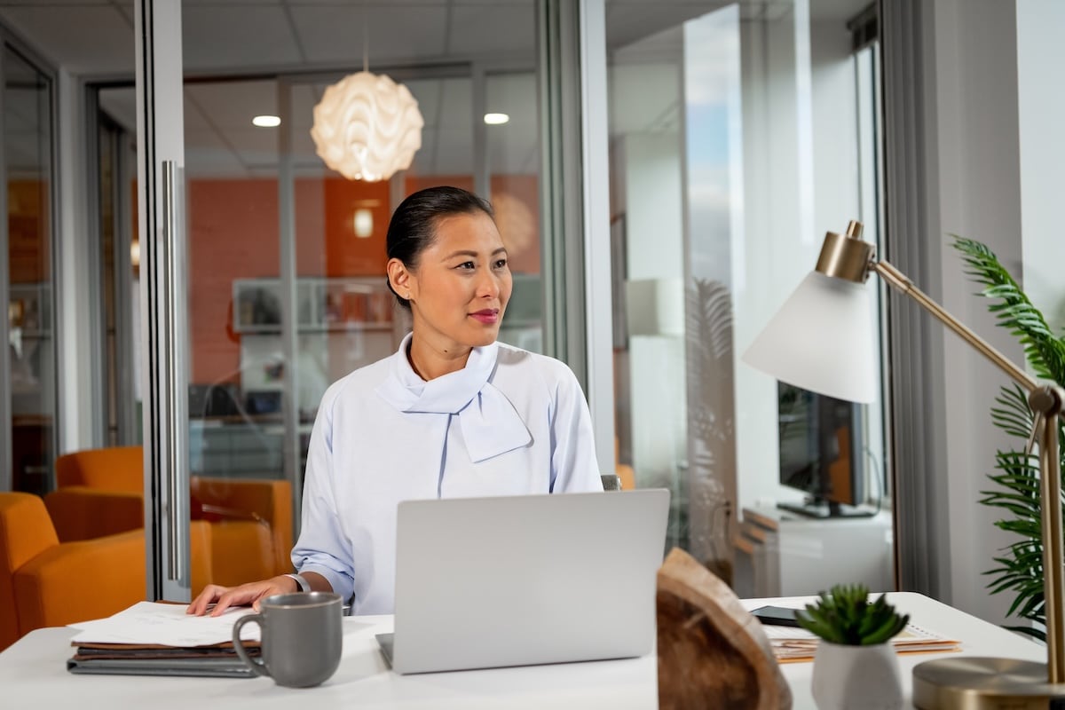 Woman in an office working on a computer