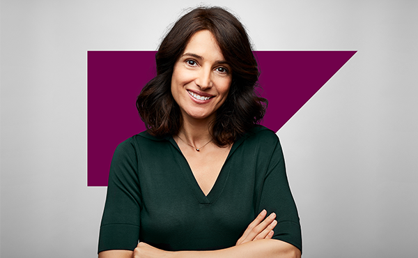 smiling woman with arms crossed