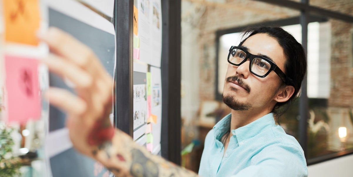 professional man in office using whiteboard
