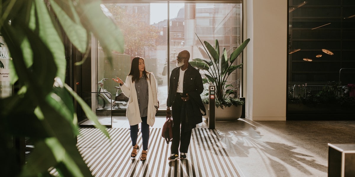 two people in an office lobby