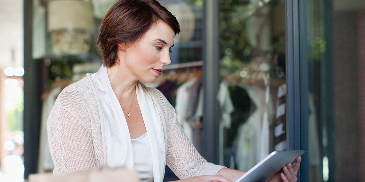 woman looking at ipad